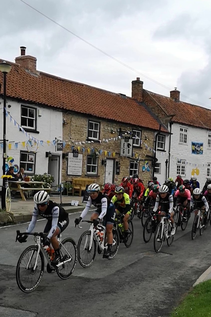 The peloton flies past...